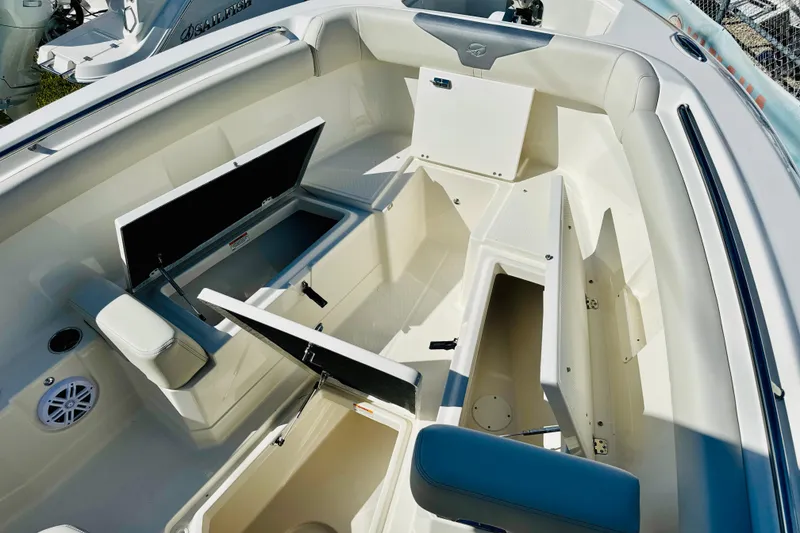 Slide: The Image of 2026 Sailfish 272 CC boat interior with open storage compartments and seating. - 23