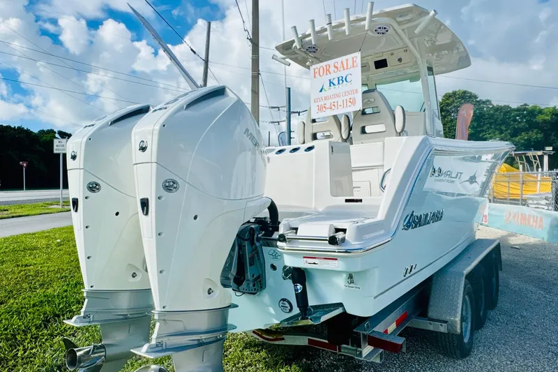 Slide: The Image of 2026 Sailfish 272 CC boat for sale, featuring dual outboard motors, on a trailer. - 3