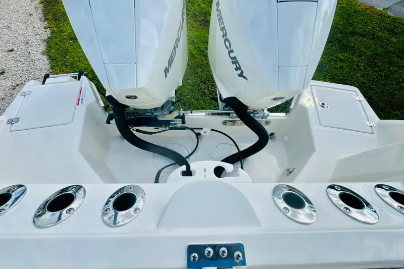 Slide: The Image of 2026 Sailfish 272 CC boat with dual Mercury engines and rod holders. - 4