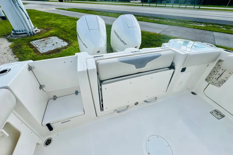 Slide: The Image of 2026 Sailfish 272 CC boat interior with dual Mercury engines and seating area. - 5