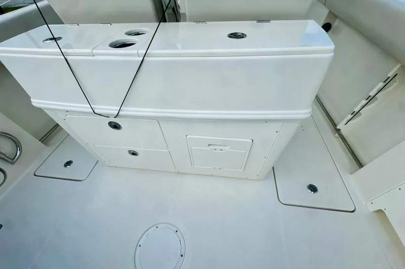 Slide: The Image of 2026 Sailfish 272 CC boat interior with storage compartments and clean white finish. - 6
