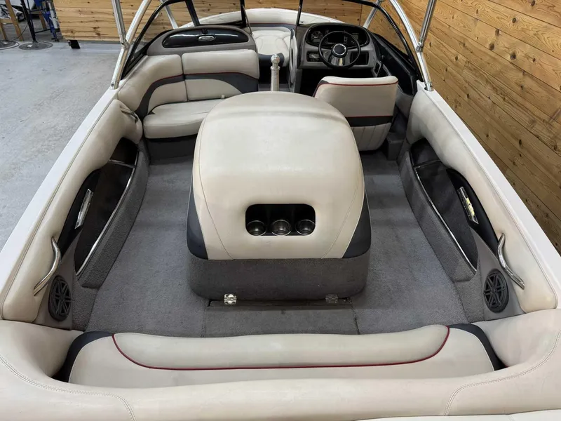 Slide: The Image of 2013 Malibu Response TXi Open Bow interior with beige seating and steering wheel. - 6