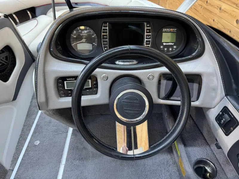 Slide: The Image of 2013 Malibu Response TXi Open Bow dashboard with steering wheel and control panel. - 7