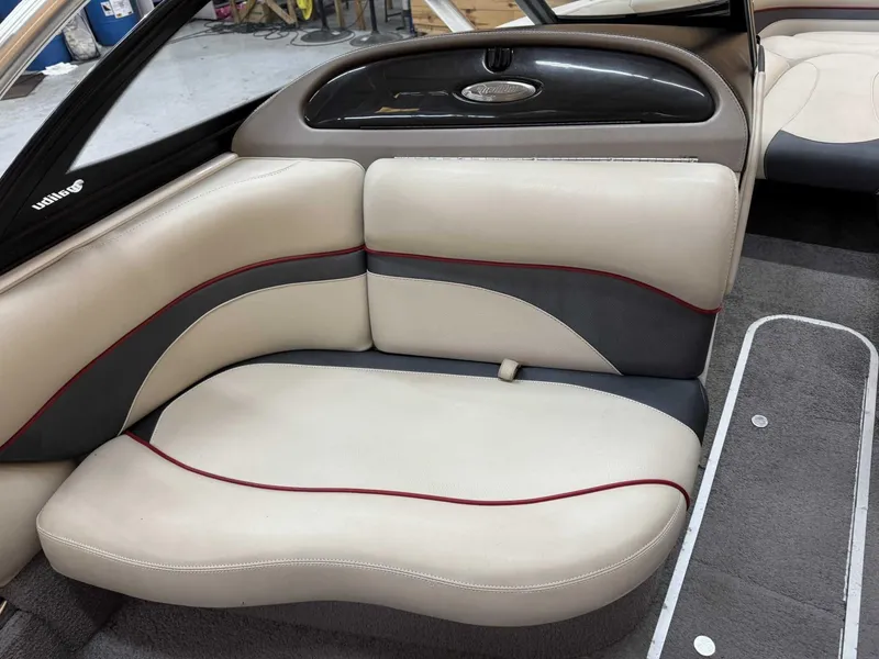 Slide: The Image of 2013 Malibu Response TXi Open Bow interior with beige and gray seating. - 8