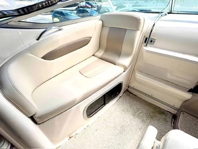 Slide: The Image of Interior seating of 2010 Chaparral Signature 270 boat, featuring beige upholstery. - 14