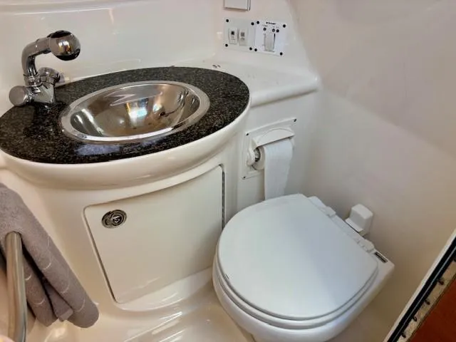 Slide: The Image of 2010 Chaparral Signature 270 bathroom with sink and toilet, featuring modern fixtures. - 8