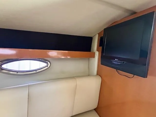 Slide: The Image of Interior of 2010 Chaparral Signature 270 with TV and porthole window. - 9