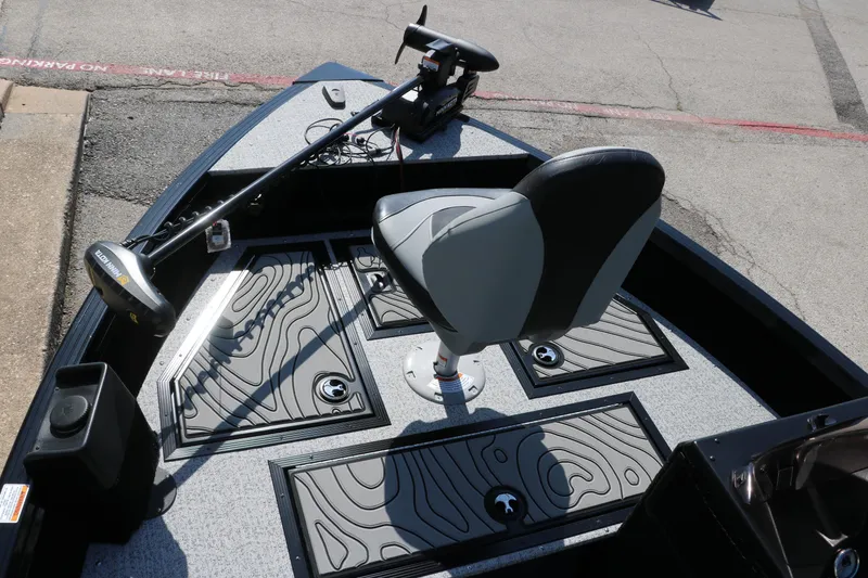 Slide: The Image of 2025 Smoker Craft Excursion 166 SC boat interior with swivel seat and trolling motor. - 15
