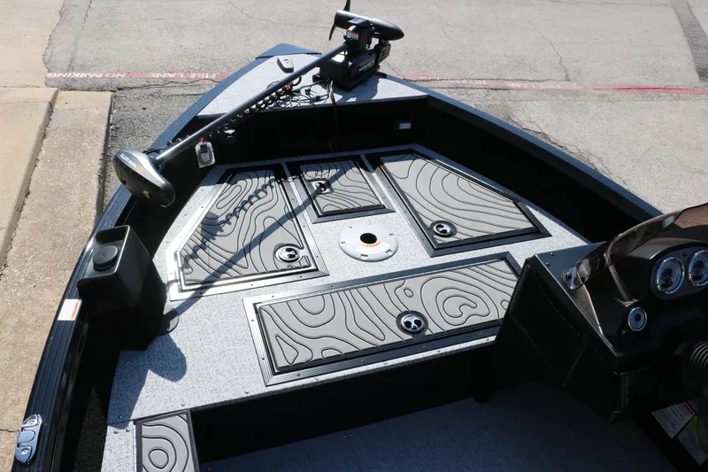 Slide: The Image of 2025 Smoker Craft Excursion 166 SC boat interior with modern dashboard and storage compartments. - 17