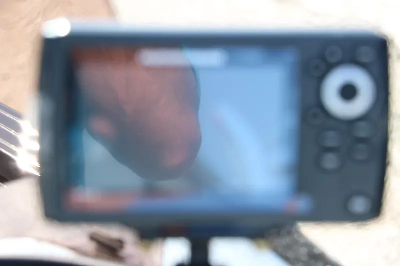 Slide: The Image of Blurry close-up of a digital display on a 2025 Smoker Craft Excursion 166 SC boat. - 20