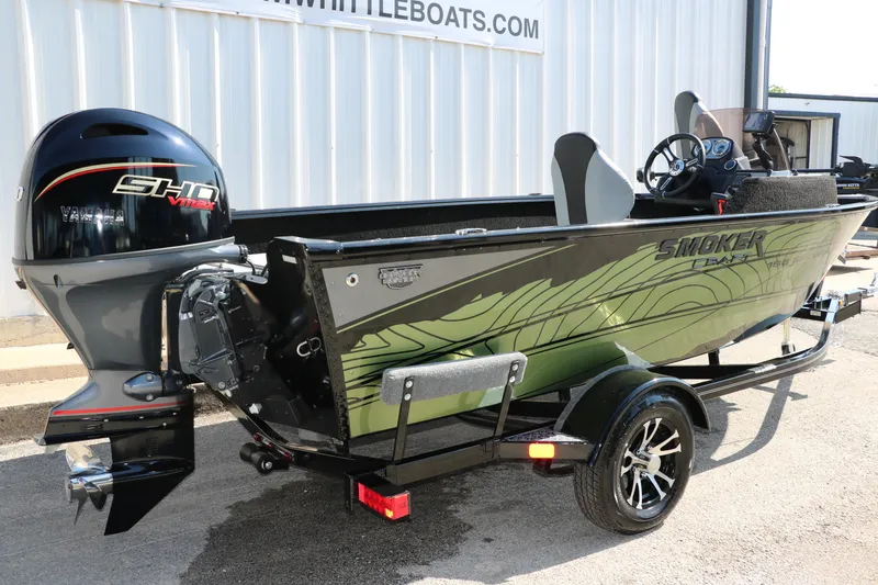 Slide: The Image of 2025 Smoker Craft Excursion 166 SC boat with Yamaha engine, parked on a trailer. - 3