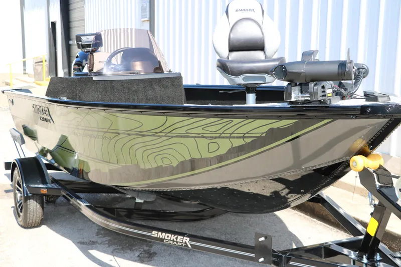 Slide: The Image of 2025 Smoker Craft Excursion 166 SC boat on trailer, featuring sleek design and modern equipment. - 5