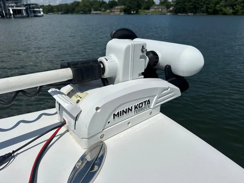 Slide: The Image of Minn Kota Terrova motor on 2021 Sportsman Masters 227 Bay Boat, lake in background. - 10