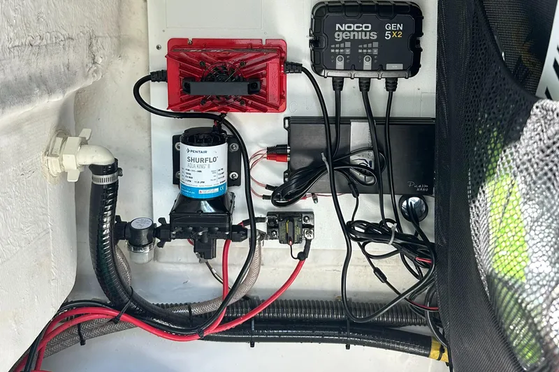 Slide: The Image of Electrical components and wiring inside a 2021 Sportsman Masters 227 Bay Boat. - 15