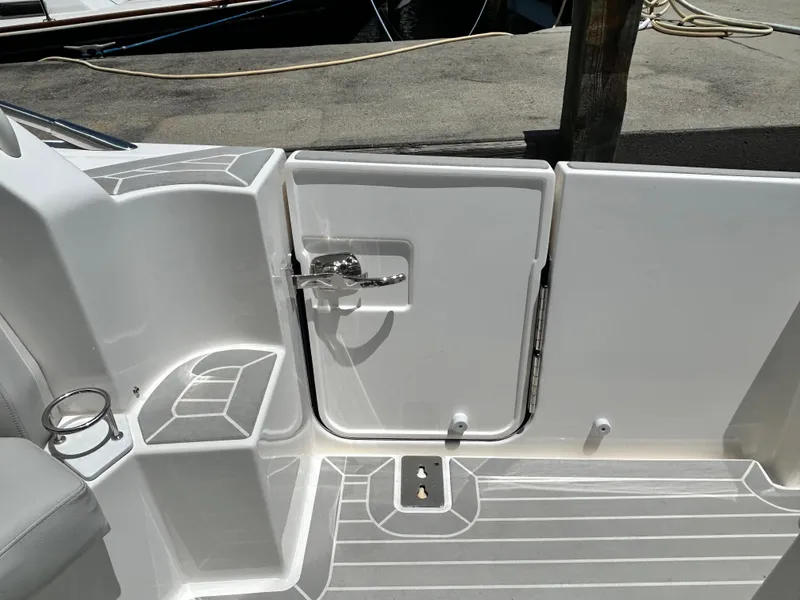 Slide: The Image of 2023 Tiara Yachts 43 LE boat deck with sleek white finish and secure hatch. - 11