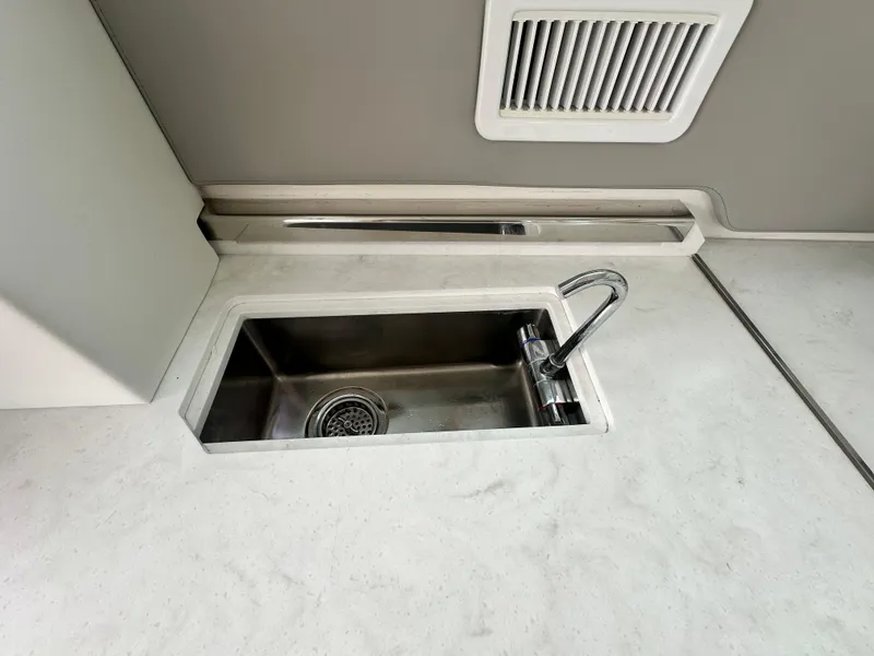 Slide: The Image of Stainless steel sink and faucet on 2023 Tiara Yachts 43 LE yacht. - 14