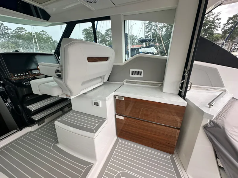 Slide: The Image of 2023 Tiara Yachts 43 LE interior with modern helm and seating area. - 26