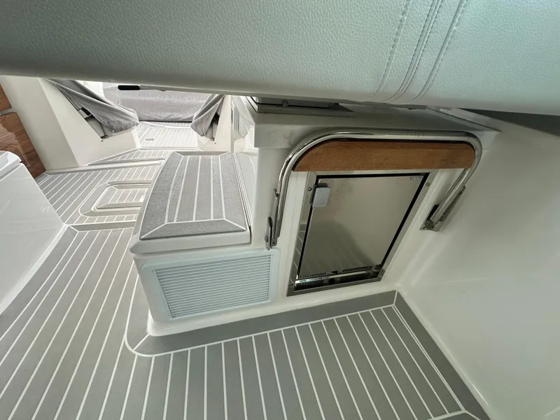 Slide: The Image of 2023 Tiara Yachts 43 LE interior with sleek flooring and compact storage. - 28