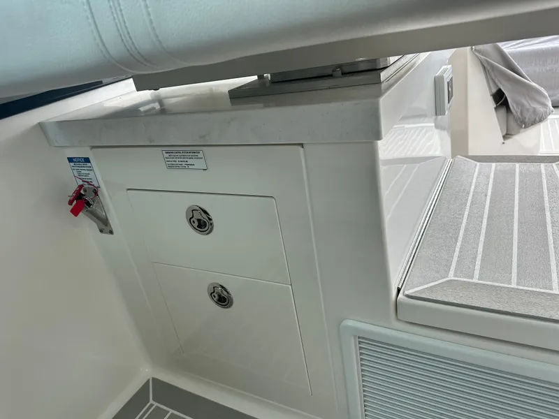 Slide: The Image of Interior of 2023 Tiara Yachts 43 LE, featuring storage compartments and sleek design elements. - 29