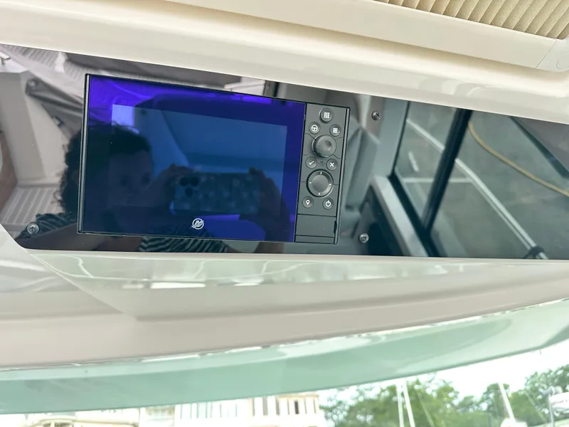 Slide: The Image of Control panel of 2023 Tiara Yachts 43 LE with digital display and buttons. - 30