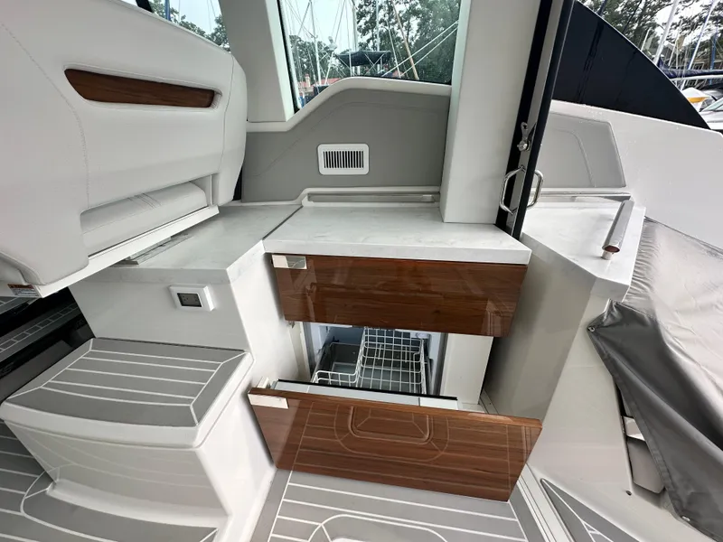 Slide: The Image of 2023 Tiara Yachts 43 LE interior with sleek cabinetry and modern design elements. - 33