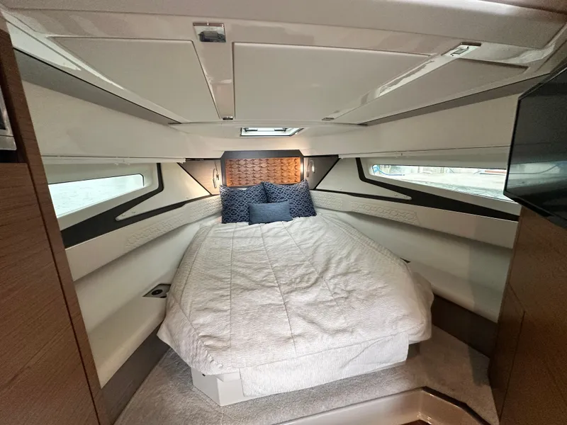 Slide: The Image of Luxurious cabin interior of 2023 Tiara Yachts 43 LE with cozy bedding and modern design. - 39