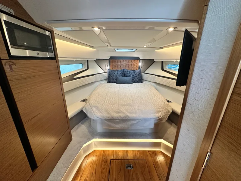 Slide: The Image of Luxurious cabin interior of 2023 Tiara Yachts 43 LE with cozy bed and modern design. - 42