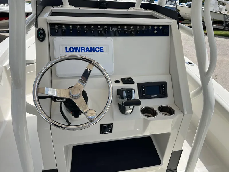 Slide: The Image of 2015 Ranger 2510 Bay boat console with steering wheel and Lowrance electronics. - 12