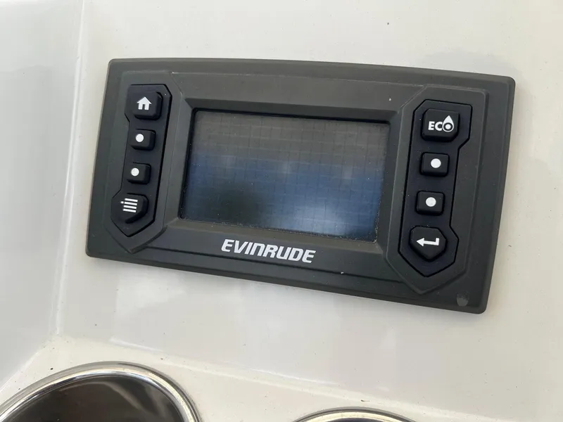 Slide: The Image of Evinrude control panel on 2015 Ranger 2510 Bay boat dashboard. - 14