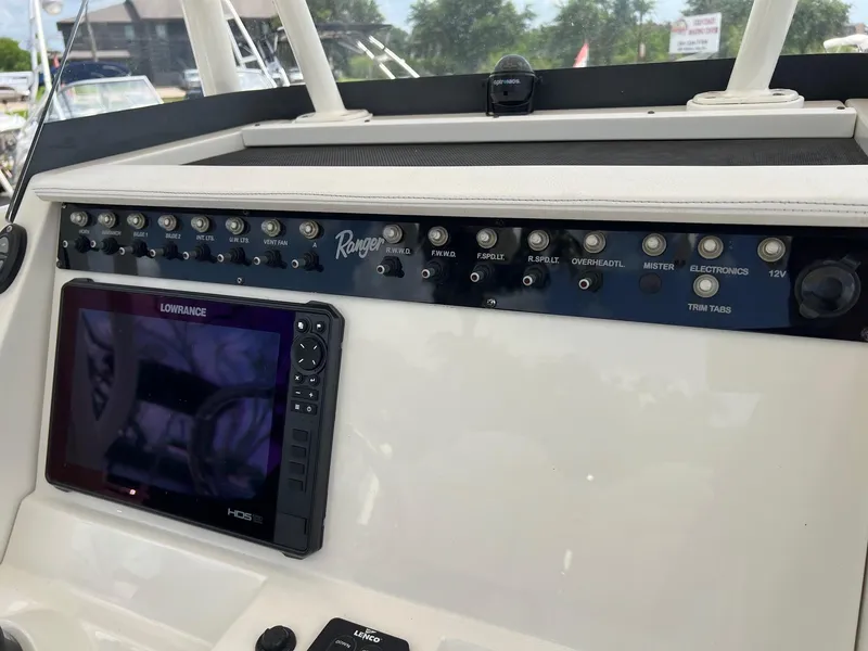 Slide: The Image of Control panel of a 2015 Ranger 2510 Bay boat with Lowrance display. - 16