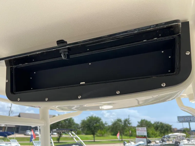 Slide: The Image of Storage compartment on a 2015 Ranger 2510 Bay boat, open and empty. - 18