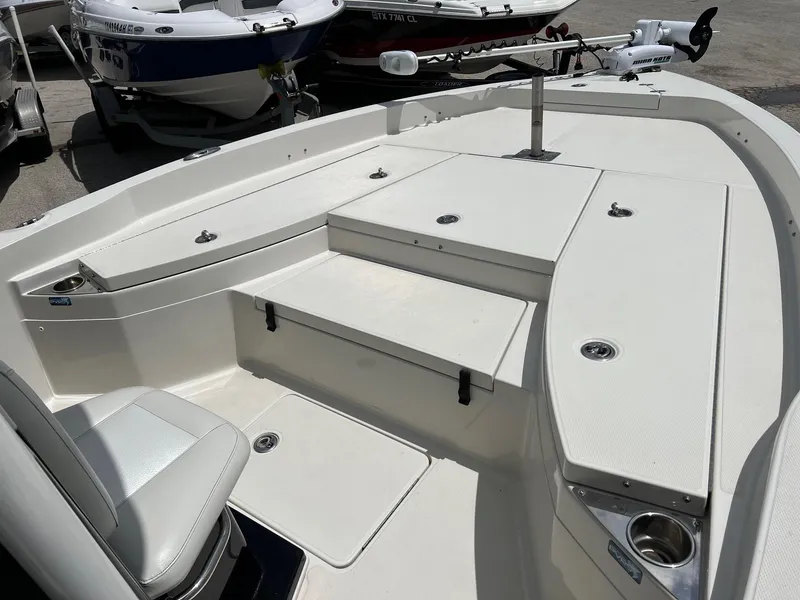 Slide: The Image of 2015 Ranger 2510 Bay boat interior with seating and storage compartments. - 19