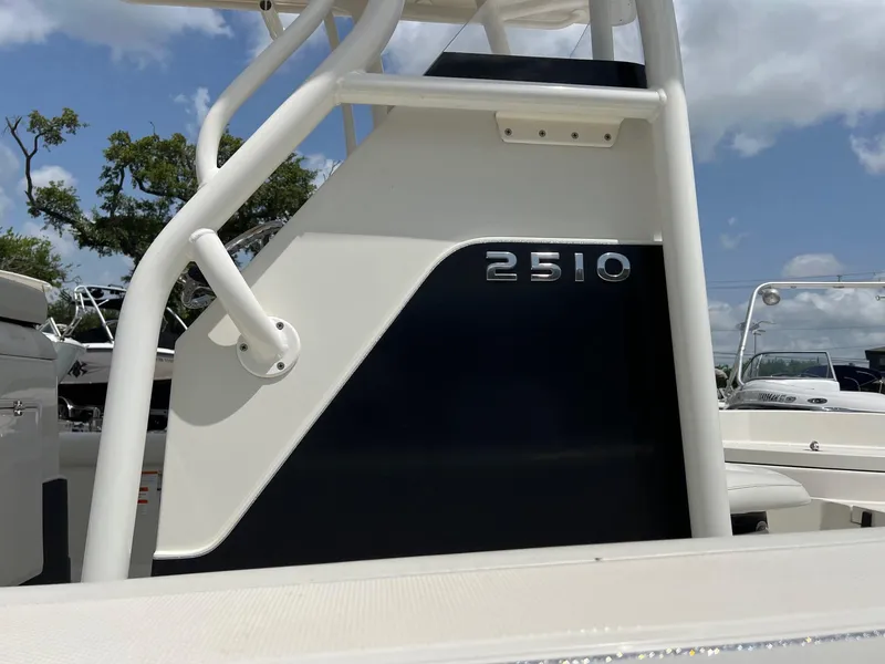 Slide: The Image of 2015 Ranger 2510 Bay boat detail with sleek design and clear sky background. - 3
