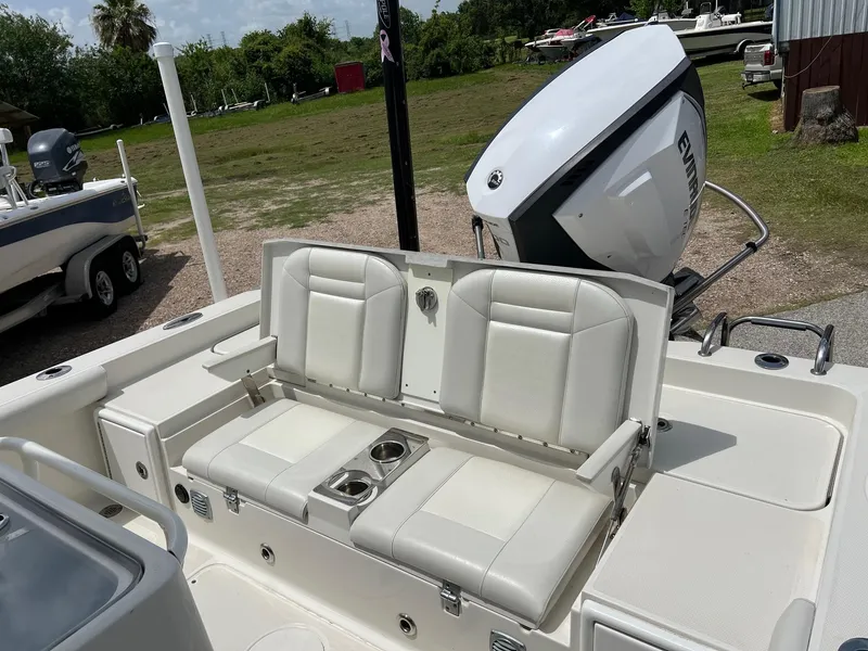 Slide: The Image of 2015 Ranger 2510 Bay boat with white seating and Evinrude outboard motor. - 6