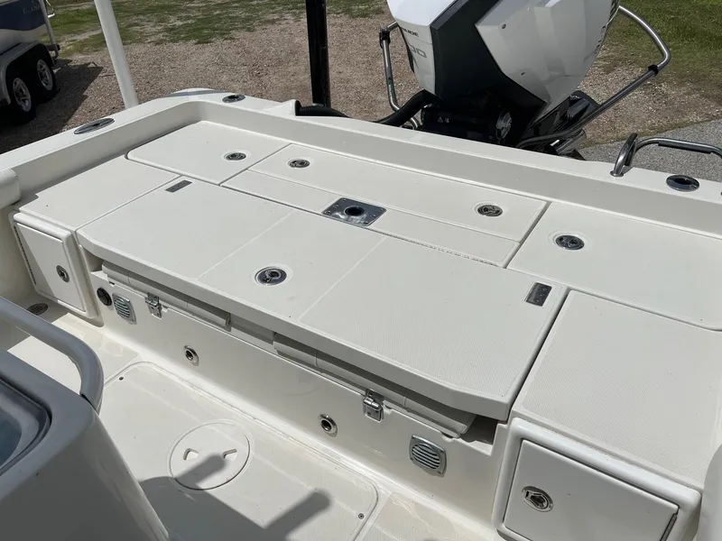Slide: The Image of 2015 Ranger 2510 Bay boat deck with storage compartments and outboard motor. - 8