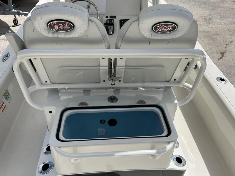 Slide: The Image of 2015 Ranger 2510 Bay boat interior with seating and storage compartment. - 9