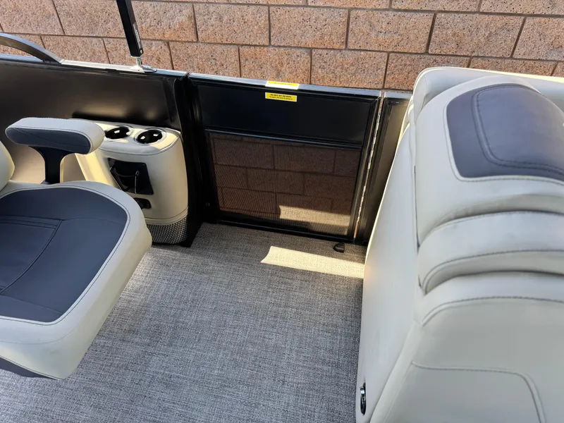 Slide: The Image of 2023 Barletta Cabrio 24UC interior with seating and cup holders. - 14