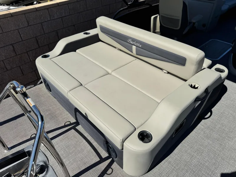 Slide: The Image of 2023 Barletta Cabrio 24UC boat seating with cup holders, showcasing luxury and comfort. - 16