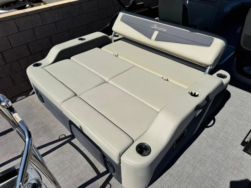 Slide: The Image of 2023 Barletta Cabrio 24UC boat seating with cup holders, showcasing luxury and comfort. - 17