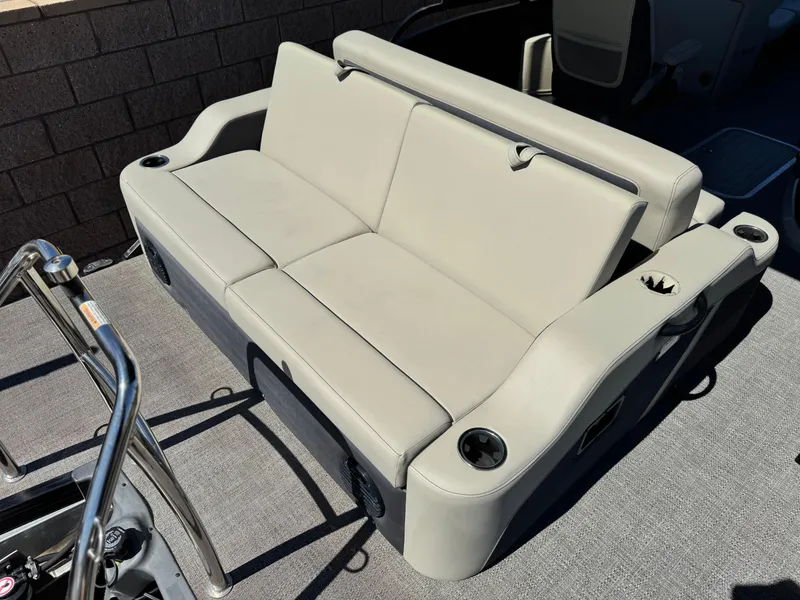 Slide: The Image of 2023 Barletta Cabrio 24UC boat seating with cup holders and sleek design. - 18