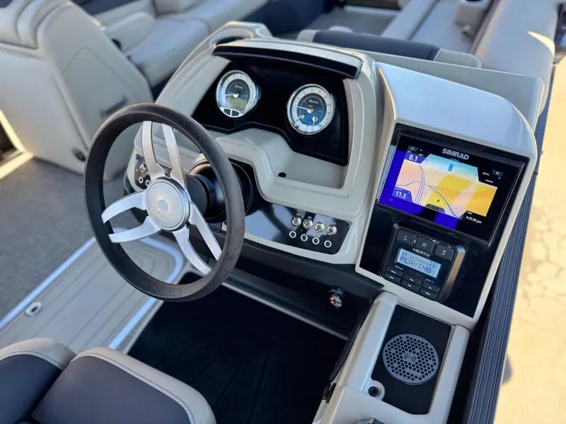 Slide: The Image of 2023 Barletta Cabrio 24UC dashboard with steering wheel, gauges, and navigation display. - 29