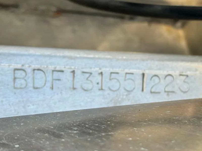 Slide: The Image of Close-up of a 2023 Barletta Cabrio 24UC serial number engraving. - 32