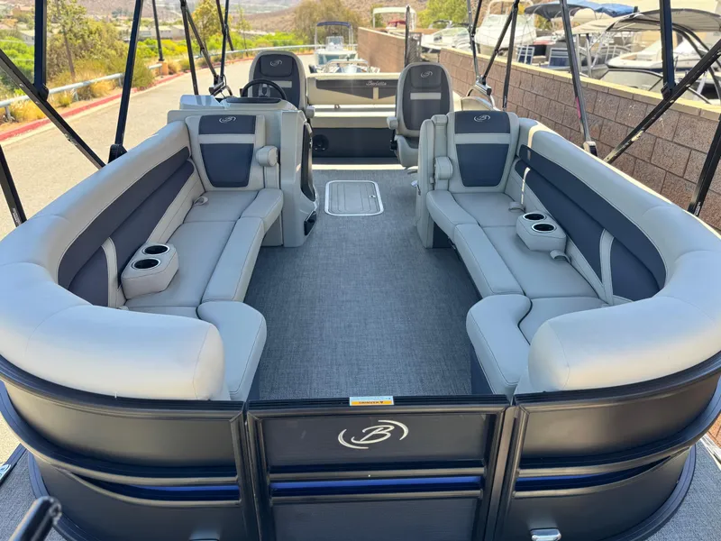 Slide: The Image of 2023 Barletta Cabrio 24UC pontoon boat with spacious seating and modern design. - 8