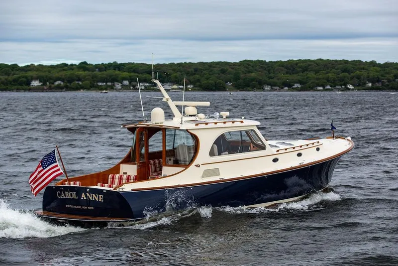 Slide: The Image of 2007 Hinckley Talaria 44 MY yacht cruising on a scenic waterway. - 19