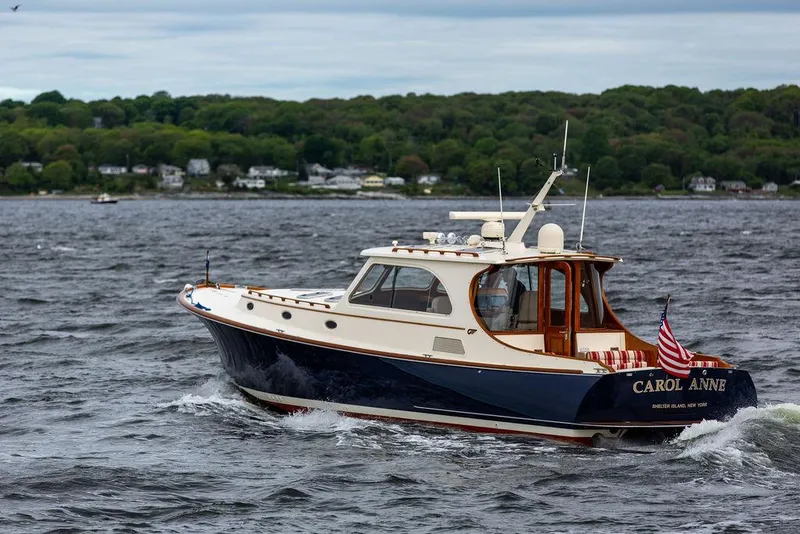 Slide: The Image of 2007 Hinckley Talaria 44 MY yacht cruising on a scenic waterway. - 20