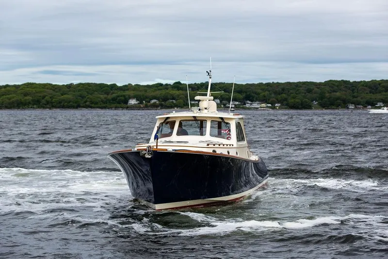 Slide: The Image of 2007 Hinckley Talaria 44 MY cruising on a scenic waterway. - 3