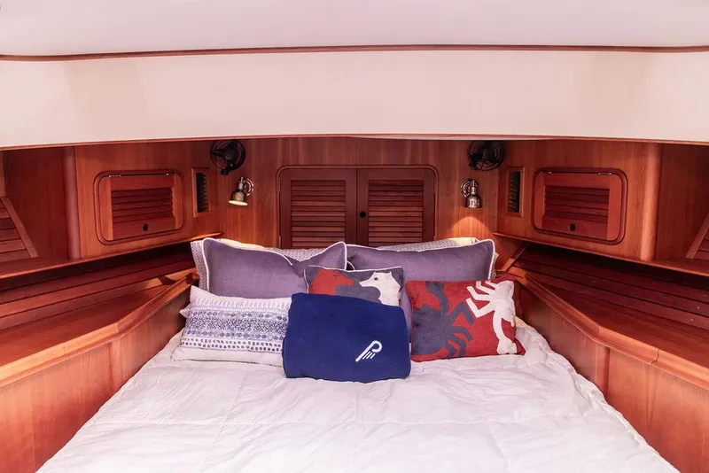Slide: The Image of Luxurious cabin interior of 2007 Hinckley Talaria 44 MY yacht with cozy bedding. - 49