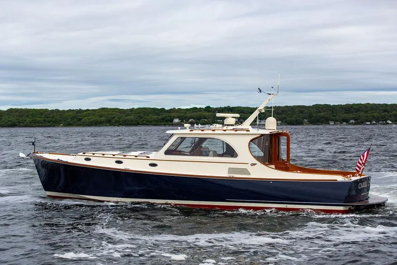 Slide: The Image of 2007 Hinckley Talaria 44 MY yacht cruising on a scenic waterway. - 9