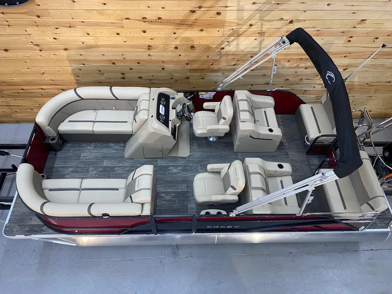 Slide: The Image of 2023 Crest Classic LX 220 SLRC pontoon boat with beige seating and black canopy. - 11