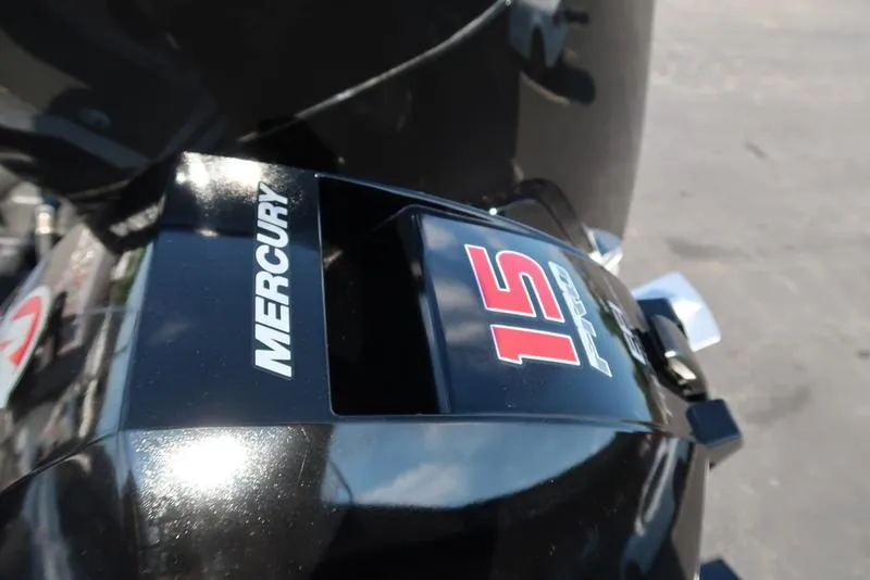 Slide: The Image of Close-up of a Mercury 15 Pro outboard motor on a 2024 Warrior 238 DC boat. - 6
